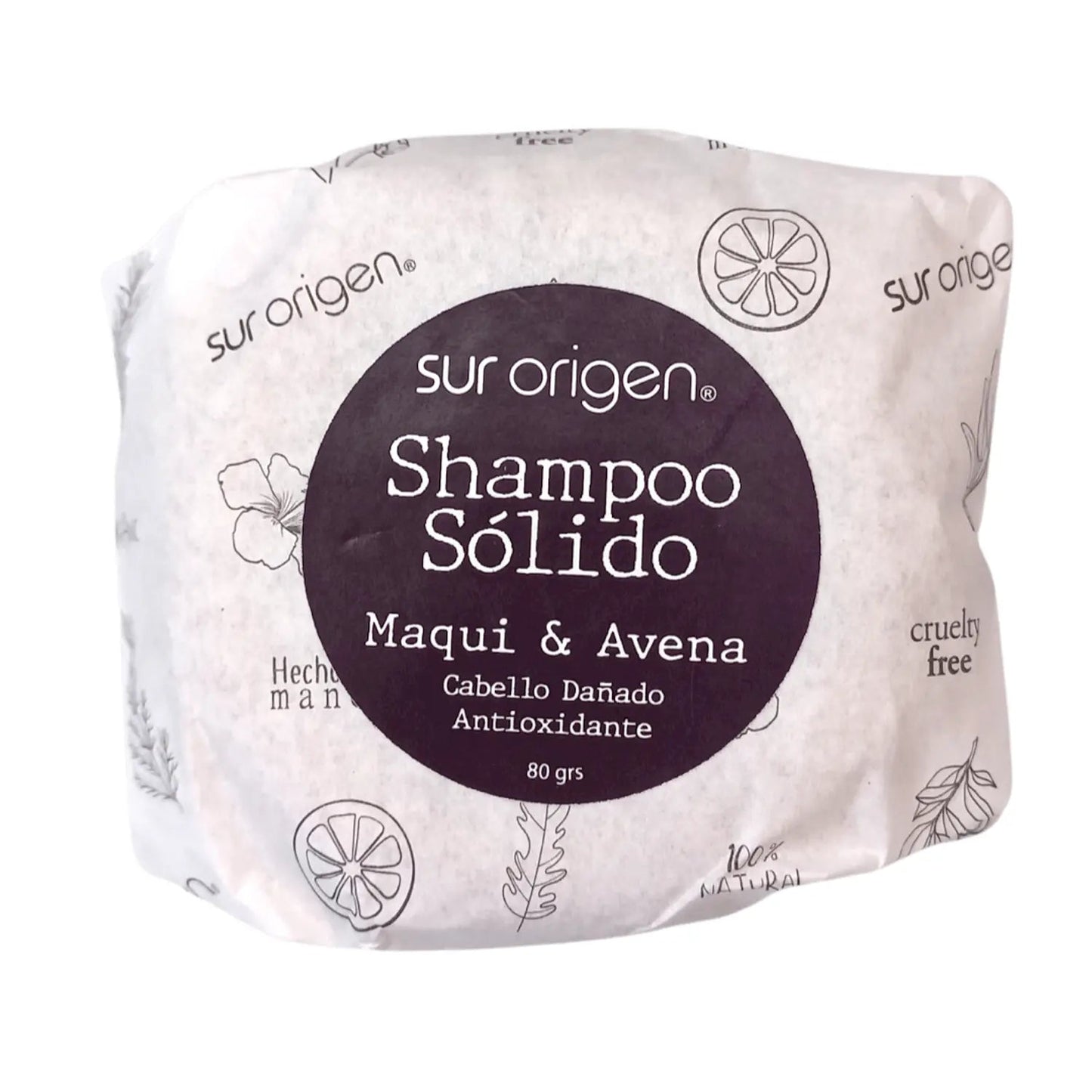 Empaque de shampoo sólido Sur Origen con maqui y avena, formulado para cabello dañado con propiedades antioxidantes. Envuelto en papel ecológico con ilustraciones botánicas en tonos beige y morado oscuro. Etiqueta con certificaciones hecho a mano, cruelty