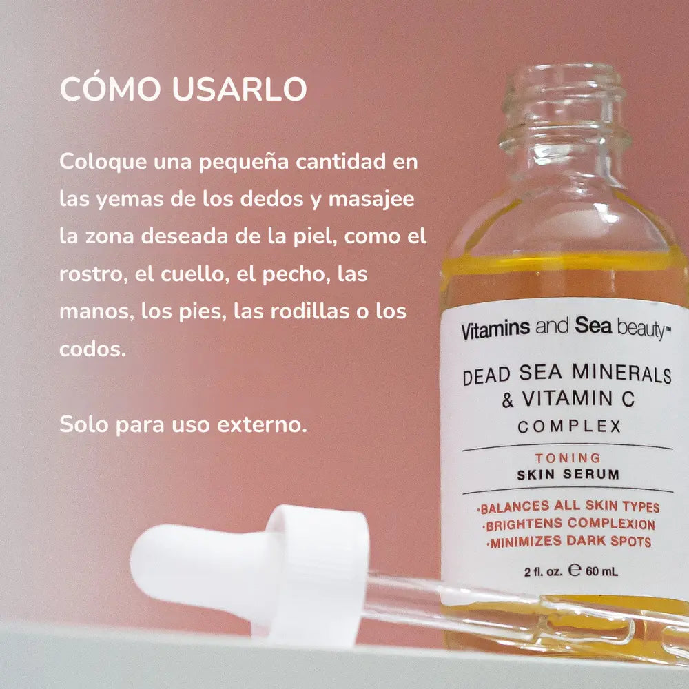 Suero facial Vitamins and Sea Beauty sobre fondo rosa con gotero destapado, acompañado de instrucciones sobre cómo aplicarlo en diferentes zonas del cuerpo para hidratar y mejorar la piel.