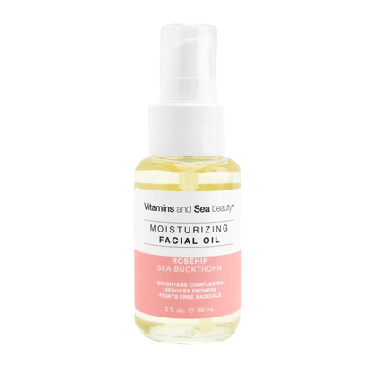 Aceite facial hidratante con rosa mosqueta y espino amarillo en un frasco transparente, que mejora la luminosidad de la piel y reduce las rojeces.